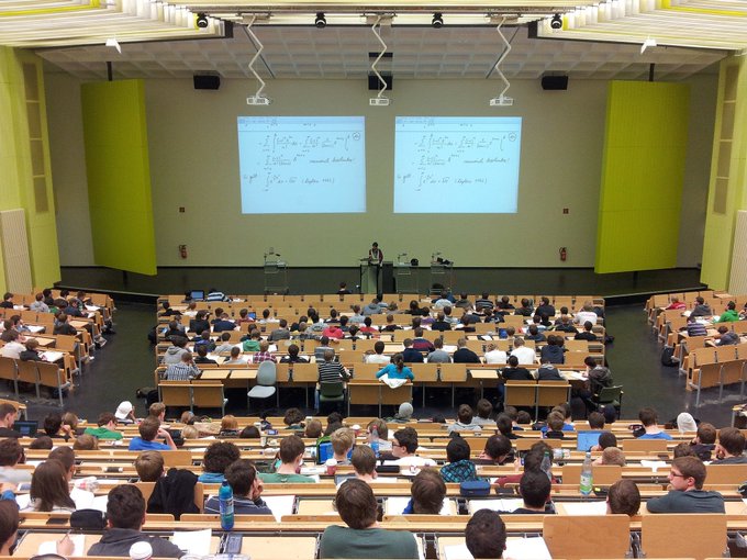 This image has an empty alt attribute; its file name is Univerity-Lecture-Hall.jpg